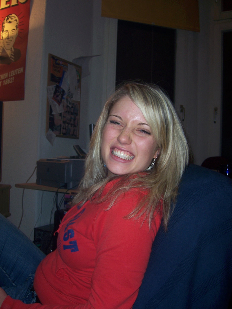 Blonde-haired busty teen gets naked and shows off 1