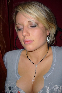 Blonde-haired busty teen gets naked and shows off-10