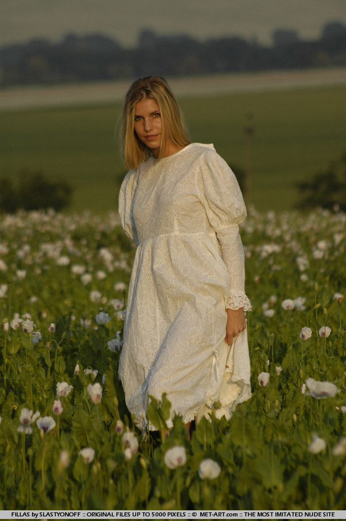 Petite blonde Iveta showing her amazing ass among flower 2