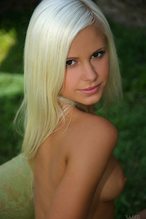 Blonde angel outdoor posing on green-13
