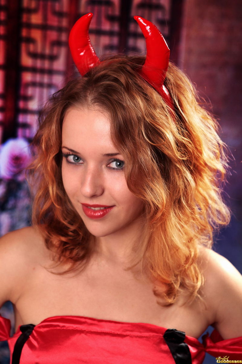 Cute devil in fishnet stockings is playing with her cunt 1
